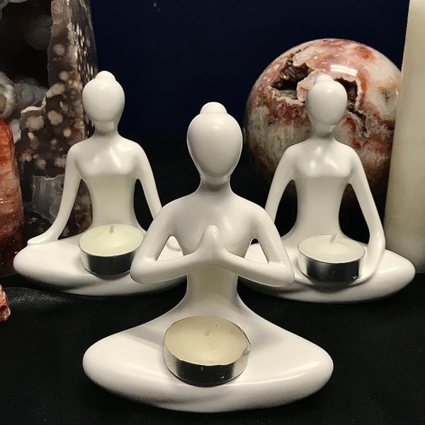 Ceramic Candle Holders in various meditation posses