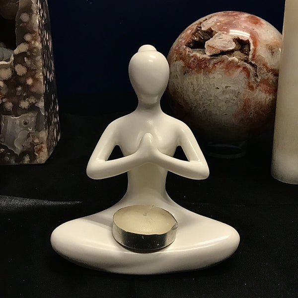 Ceramic Candle Holders in various meditation posses